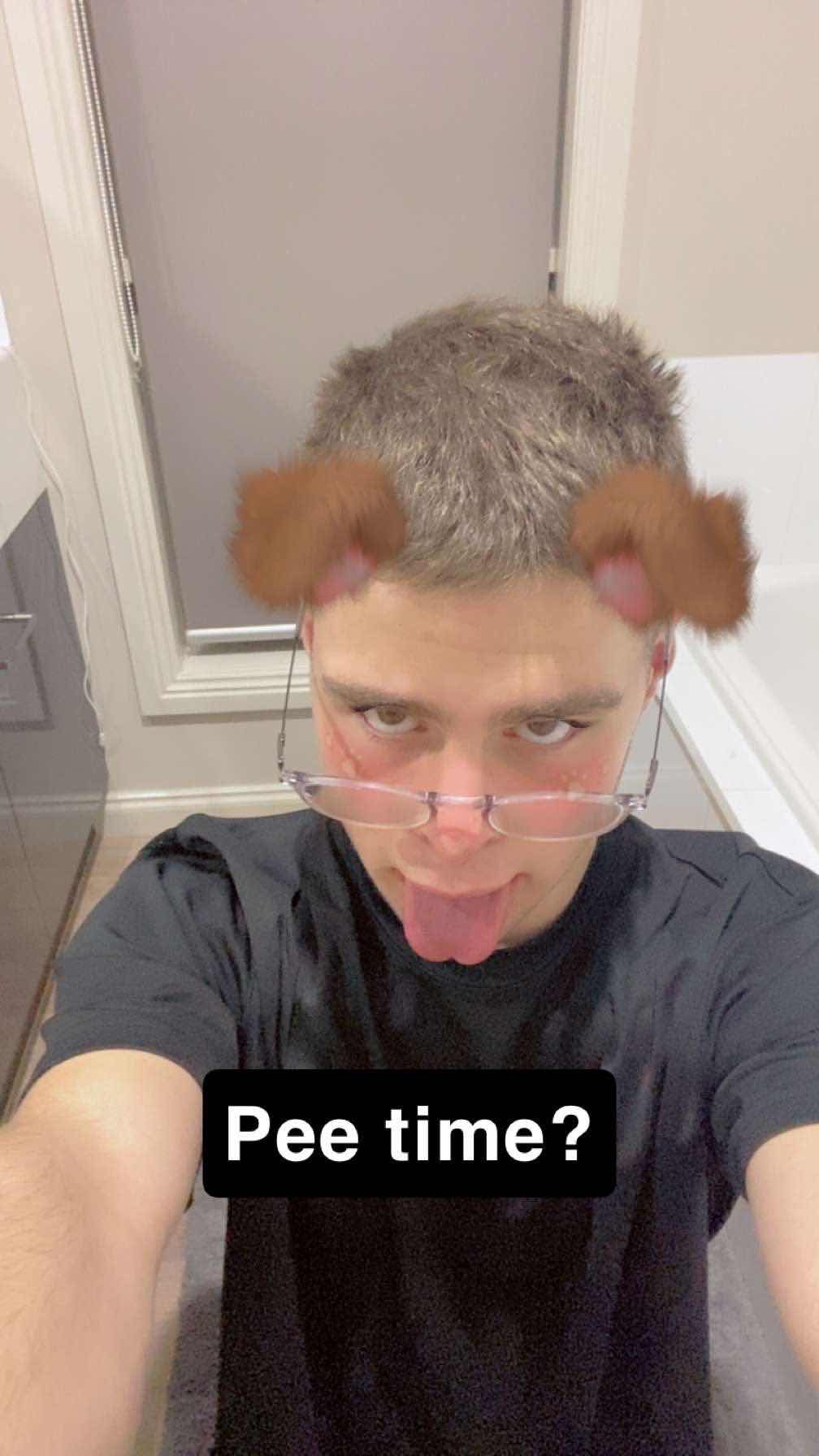 Sam with his tounge out, caption is 'pee time'.